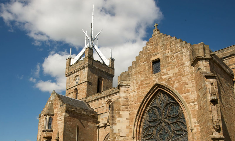 A view of the walls, roof and spire of Linlithgow Palace