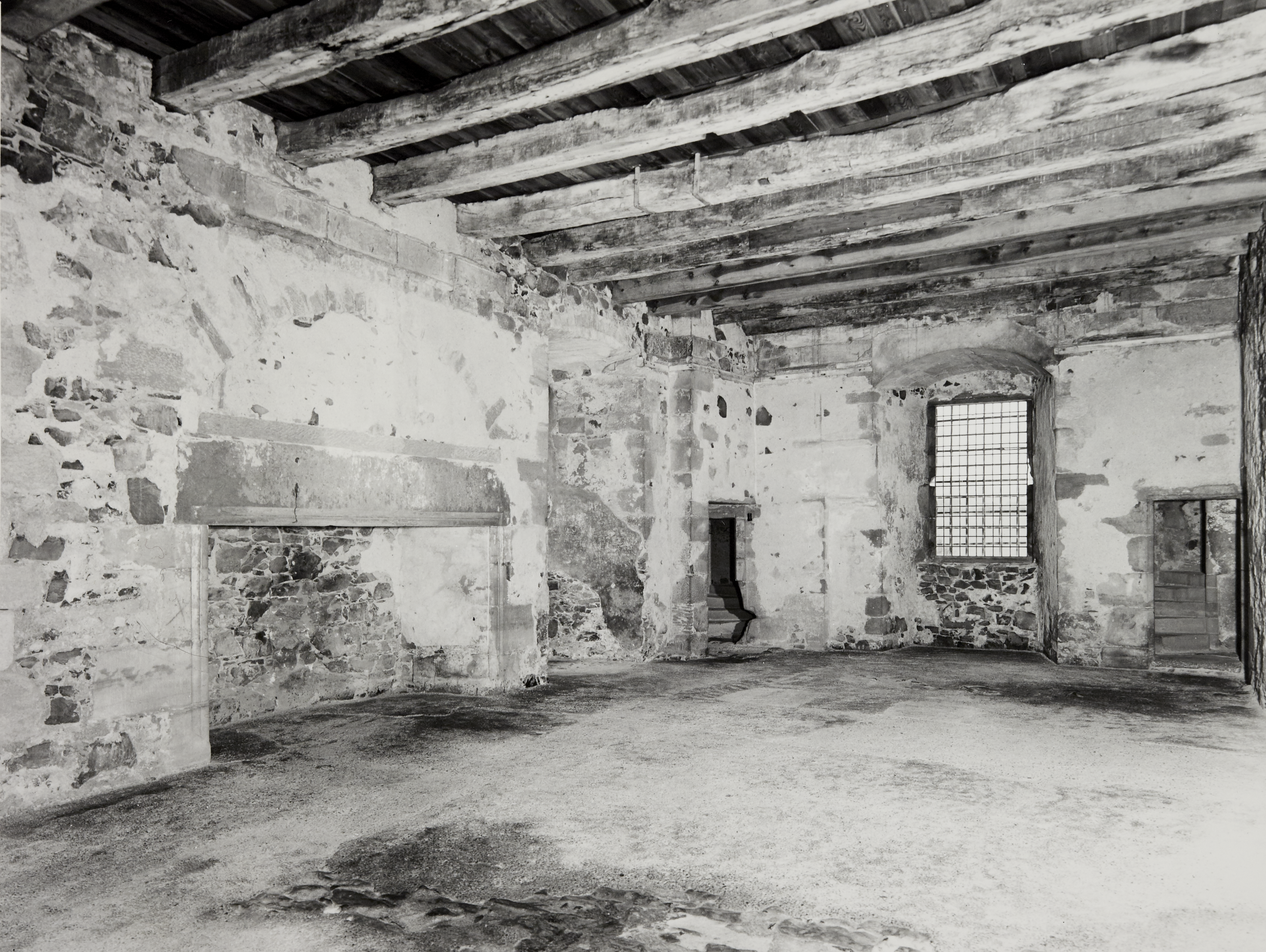 Interior room at Elcho Castle, with wooden rafters and walls in general disrepair