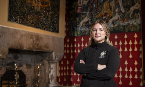 Kirsty Gallagher, A Modern Apprentice at Stirling Castle standing in the Royal Palace