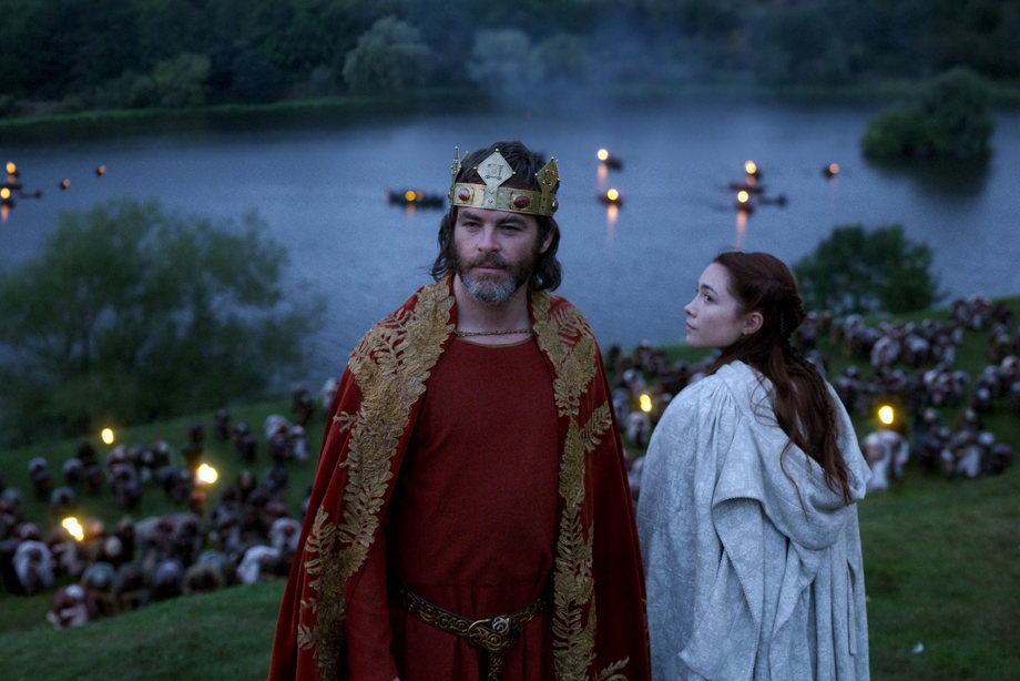 Chris Pine as Robert the Bruce and Florence Pugh as Elizabeth de Burgh on Linlithgow Peel overlooking the loch