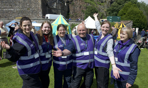 A volunteer co-ordinator with 5 event volunteers