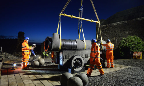 Staff members work by night to remove the cannon Mons Meg for maintenance at Edinburgh Castle.