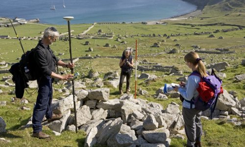 Staff surveying the settlement on St Kilda.