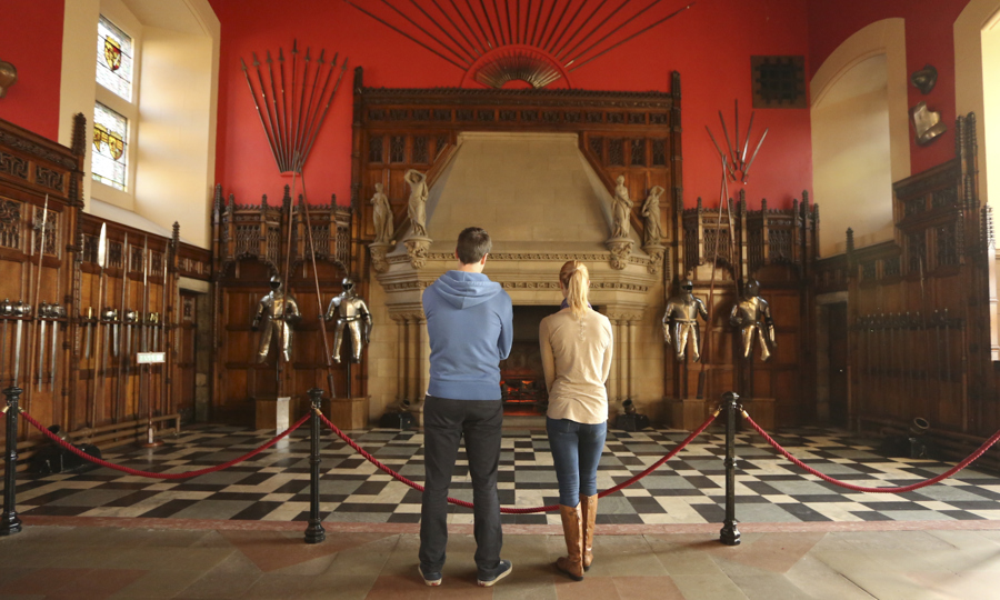 Two visitors admiring the great hall at Edinburgh Castle.