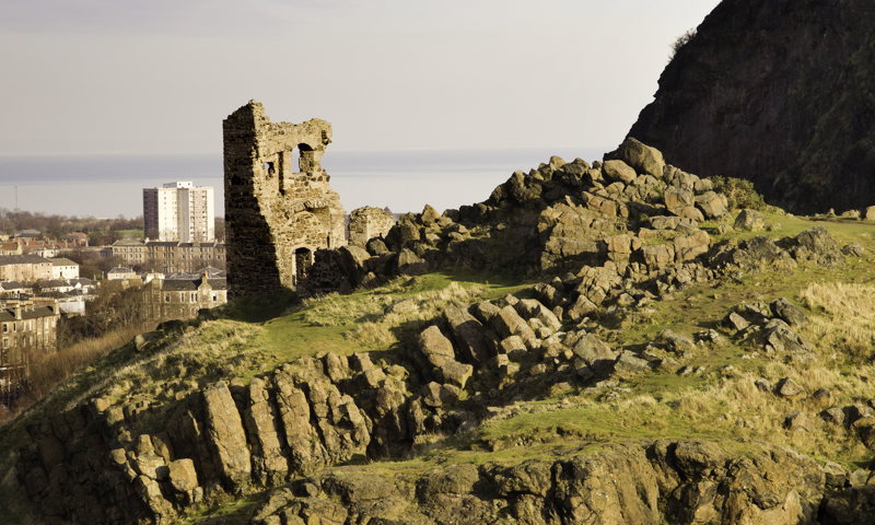 The remains of St Anthony’s Chapel, with the Firth of Forth in the background, at Holyrood Park.