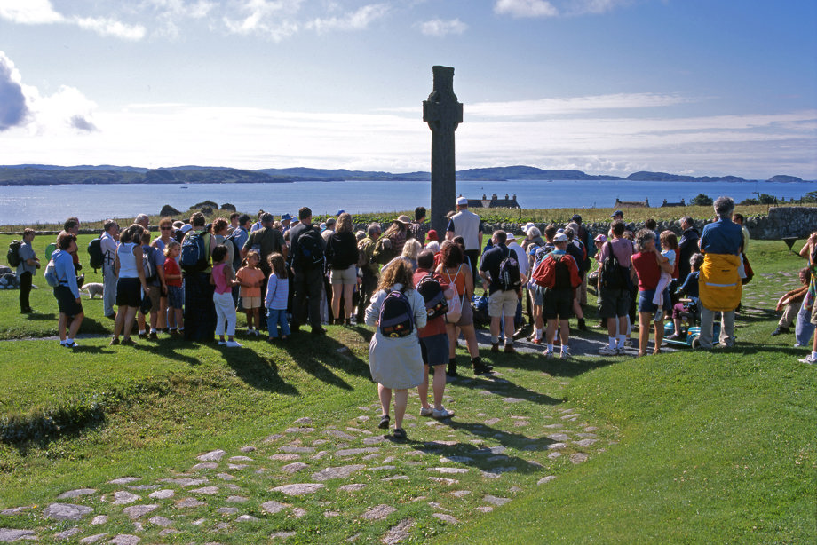 A group of visitors gather at Iona Abbey.
