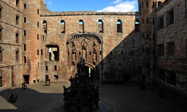 A view of the courtyard and fountain at Linlithgow Palace.