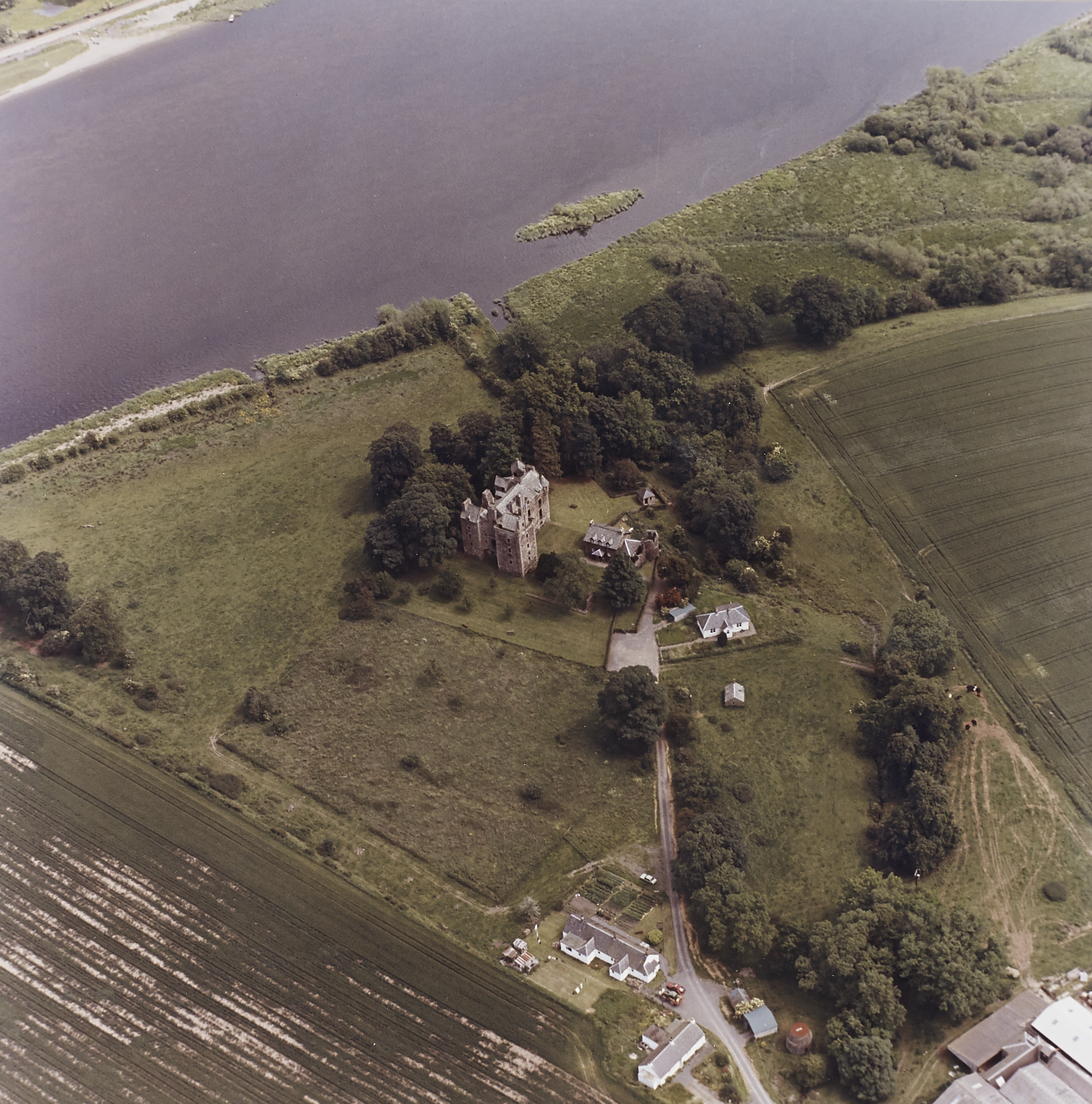 Aerial view of Elcho Castle and the surrounding area including farmland and river