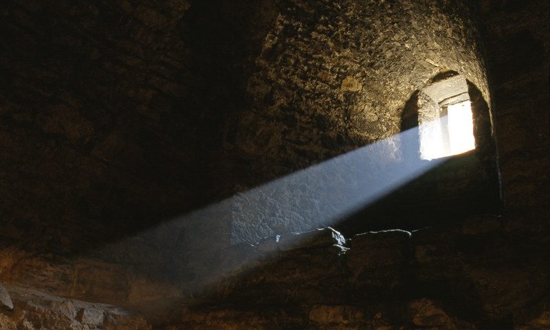 Light from a window illuminating a darkened room at Craigmillar Castle.