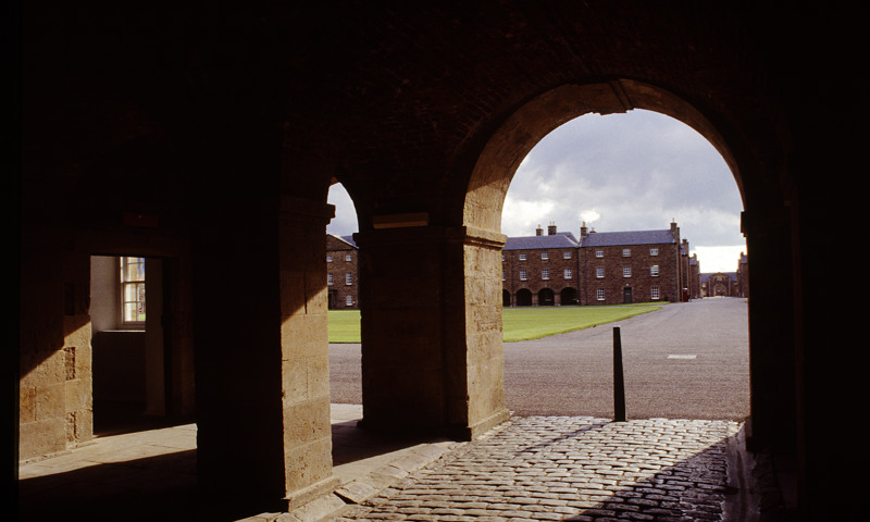 A view of buildings through an archway at Fort George.
