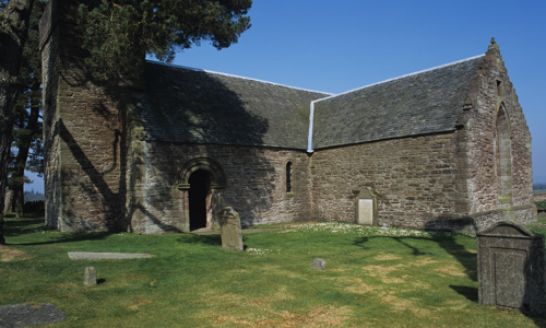 The well preserved medieval Tullibardine Chapel with a small graveyard in front of it
