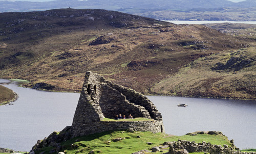 The broch of Dun Carloway overlooking a loch, with some great views over Lewis