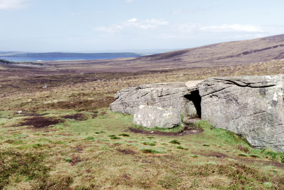 A very large block of sandstone into which a Neolithic burial chamber has been cut