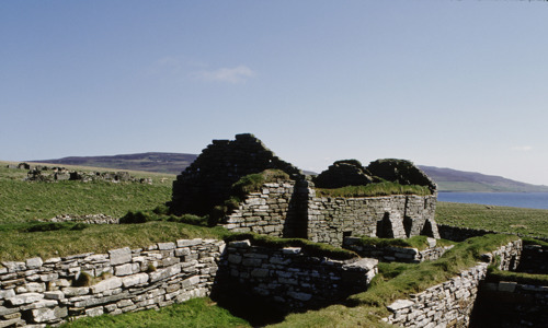 The grass covered foundations of a medieval church