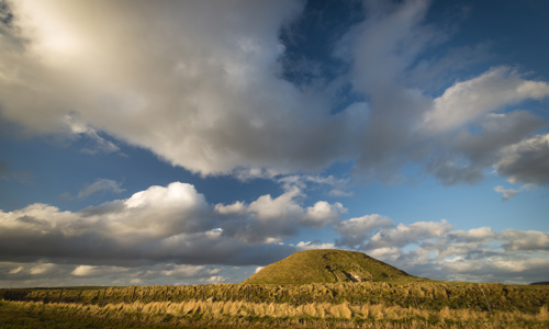 A general exterior view of Maeshowe Chambered Cairn.