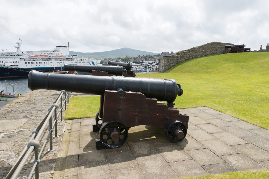A canon pointing out to sea