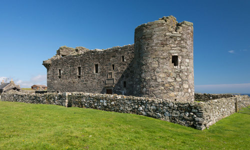 Muness Castle with its prominent round tower at the front