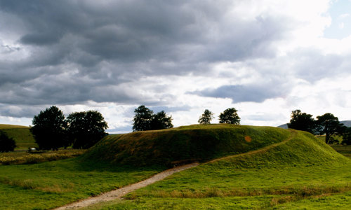 A path leading up the grassy earthworks.