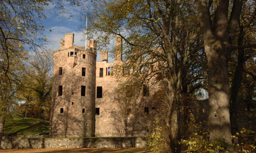 A general view of Huntly Castle and surrounding trees.