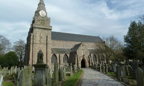 Gravestones in front of the fully preserved St Machars Cathedral
