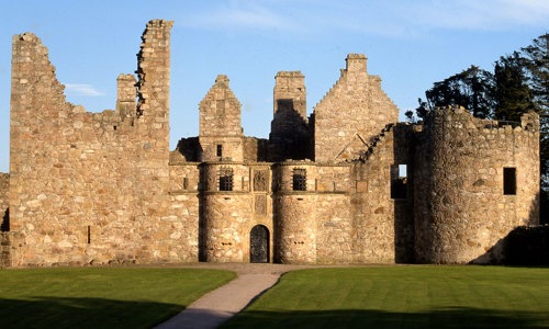 The roofless ruins of Tolquhon Castle on a sunny day