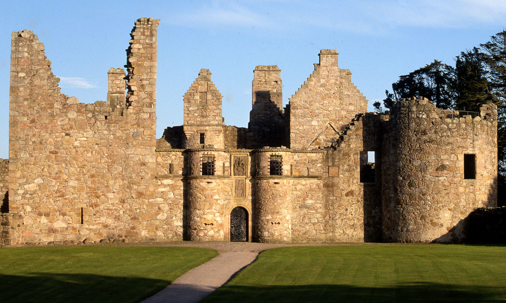 The roofless ruins of Tolquhon Castle on a sunny day