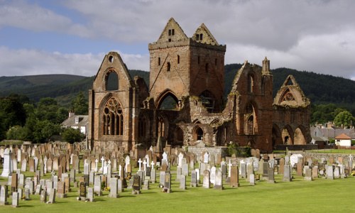 A general view of Sweetheart Abbey and its graveyard.
