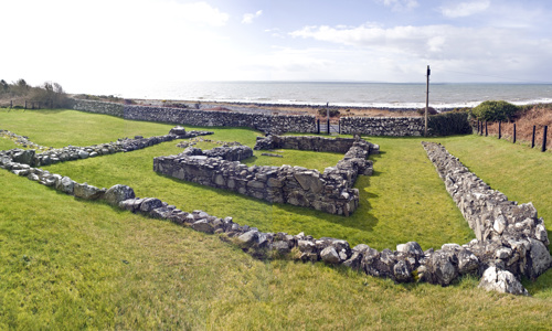 The stone foundations of a chapel and a rectangular wall around it