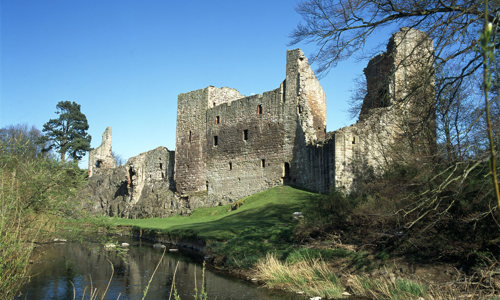 The ruins of Hailes Castle on a riverbank