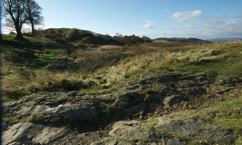 Some stones on  a grassy hill