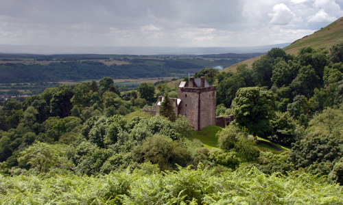A distant view of Castle Campbell and the surrounding countryside.