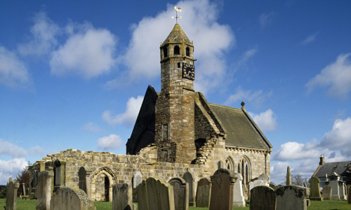 Gravestones stand before St Bride