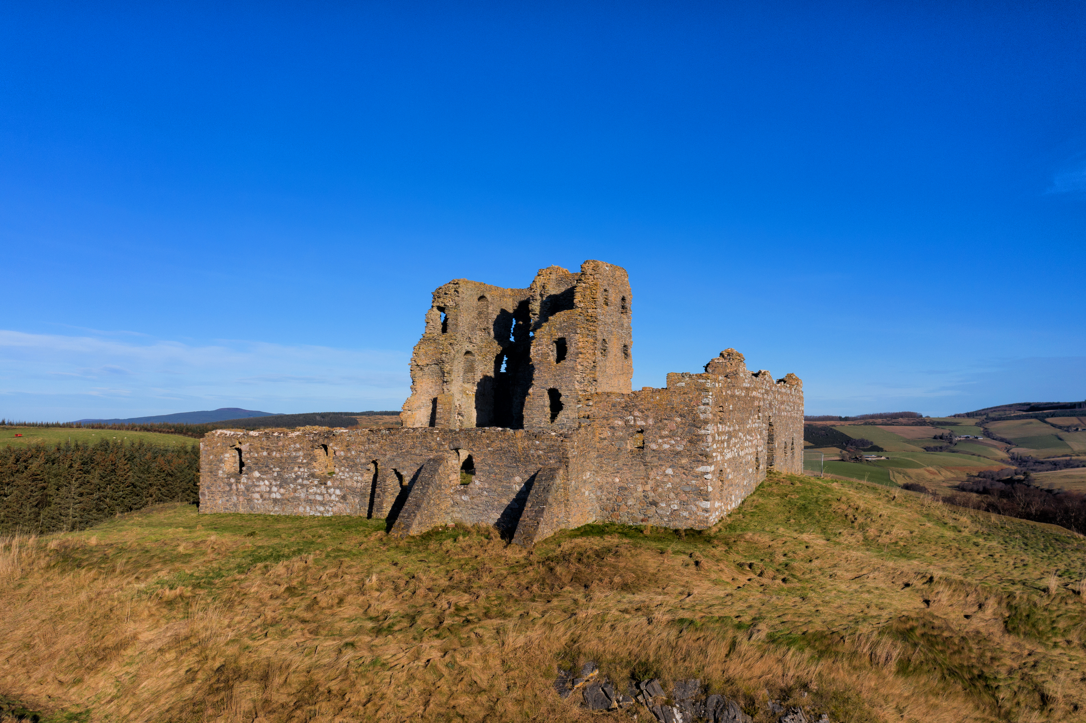 A beautiful blue sky above the ruins of a stone castl