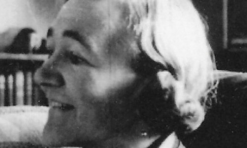 Young woman with short hair, photographed in side profile. Image is black and white.