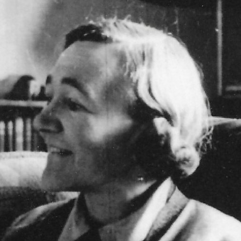 Young woman with short hair, photographed in side profile. Image is black and white.