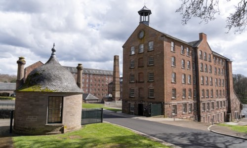 An outside view of Stanley Mills on a cloudy day 