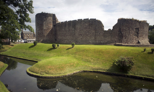 A general view of the circular curtain wall and moat at Rothesay Castle.
