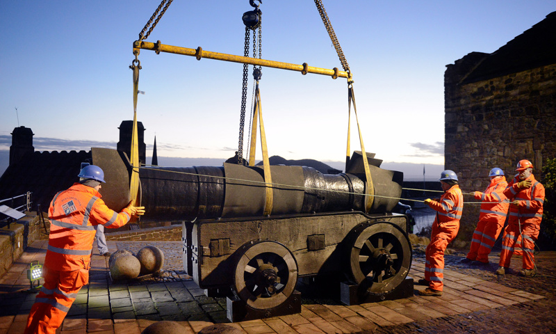 The medieval Mons Meg cannon is removed from Edinburgh Castle for essential maintenance work.