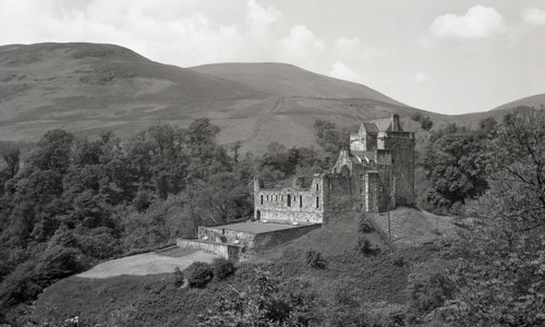 A vintage photograph of Castle Campbell and garden, seen in black and white.