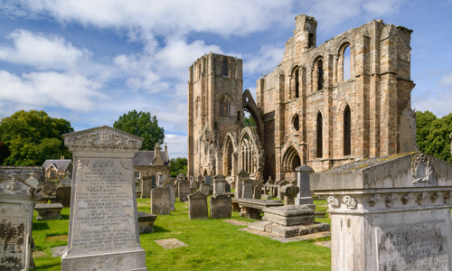 Gravestones and the ruins of Elgin Cathedral, seen from the south-east.