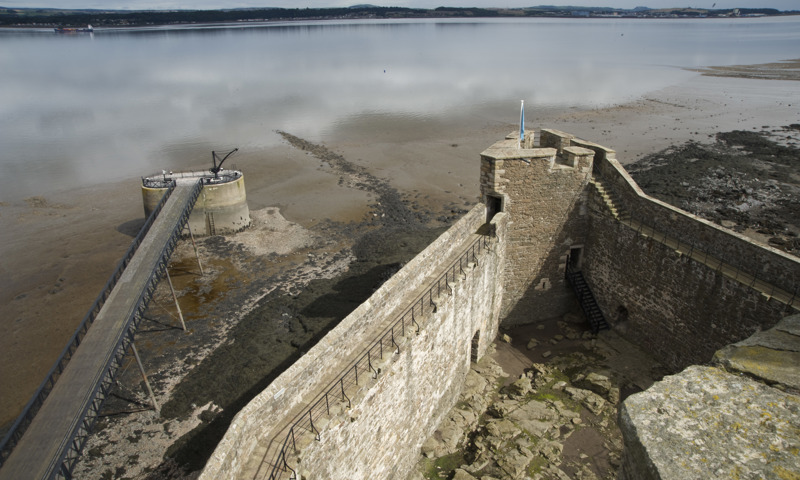 A view of the inner courtyard, northernmost tip and pier at Blackness Castle, extending into the Firth of Forth.