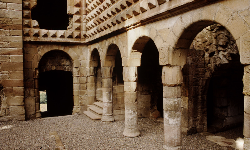Archways beneath the great diamond facade inside Crichton Castle.