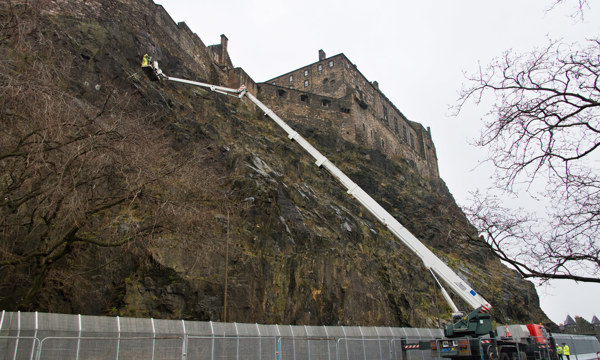 Contractors work to install a new rock trap on the south-facing side of Edinburgh Castle Rock.