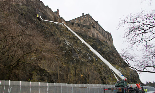 Contractors work to install a new rock trap on the south-facing side of Edinburgh Castle Rock.