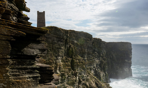 The Kitchener War Memorial, sitting atop a sheer cliff face leading down to the ocean in Orkney.
