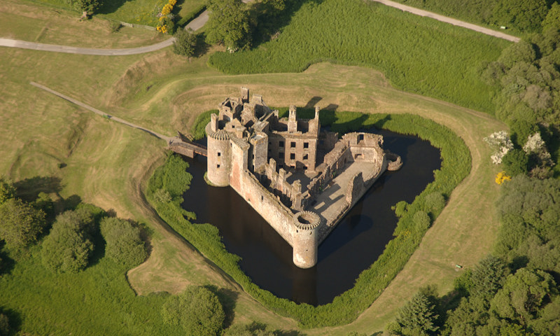 An aerial view of Caerlaverock Castle, revealing its distinctive triangular plan