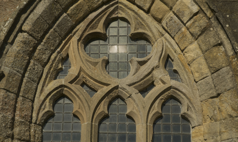 A detail of a window in the east range of Crossraguel Abbey.
