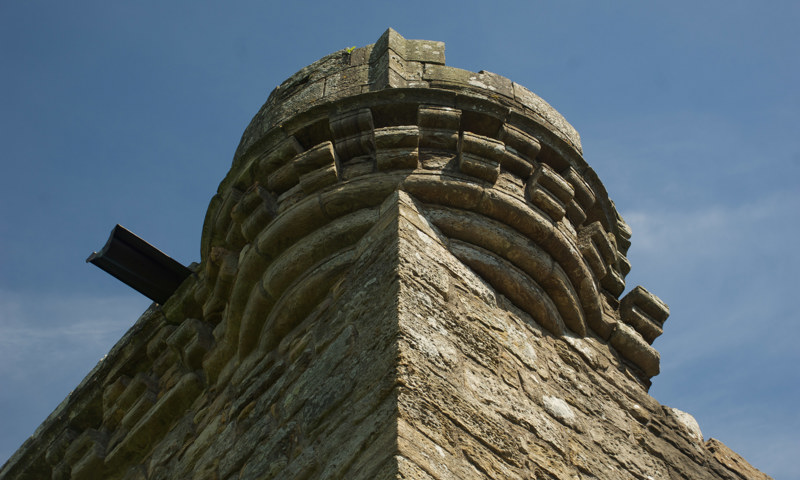 A detail of a corbelled parapet at Craignethan Castle.
