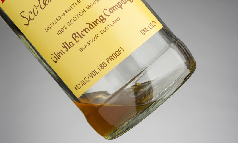 A bottle containing a small amount of whisky produced at Dallas Dhu Historic Distillery.