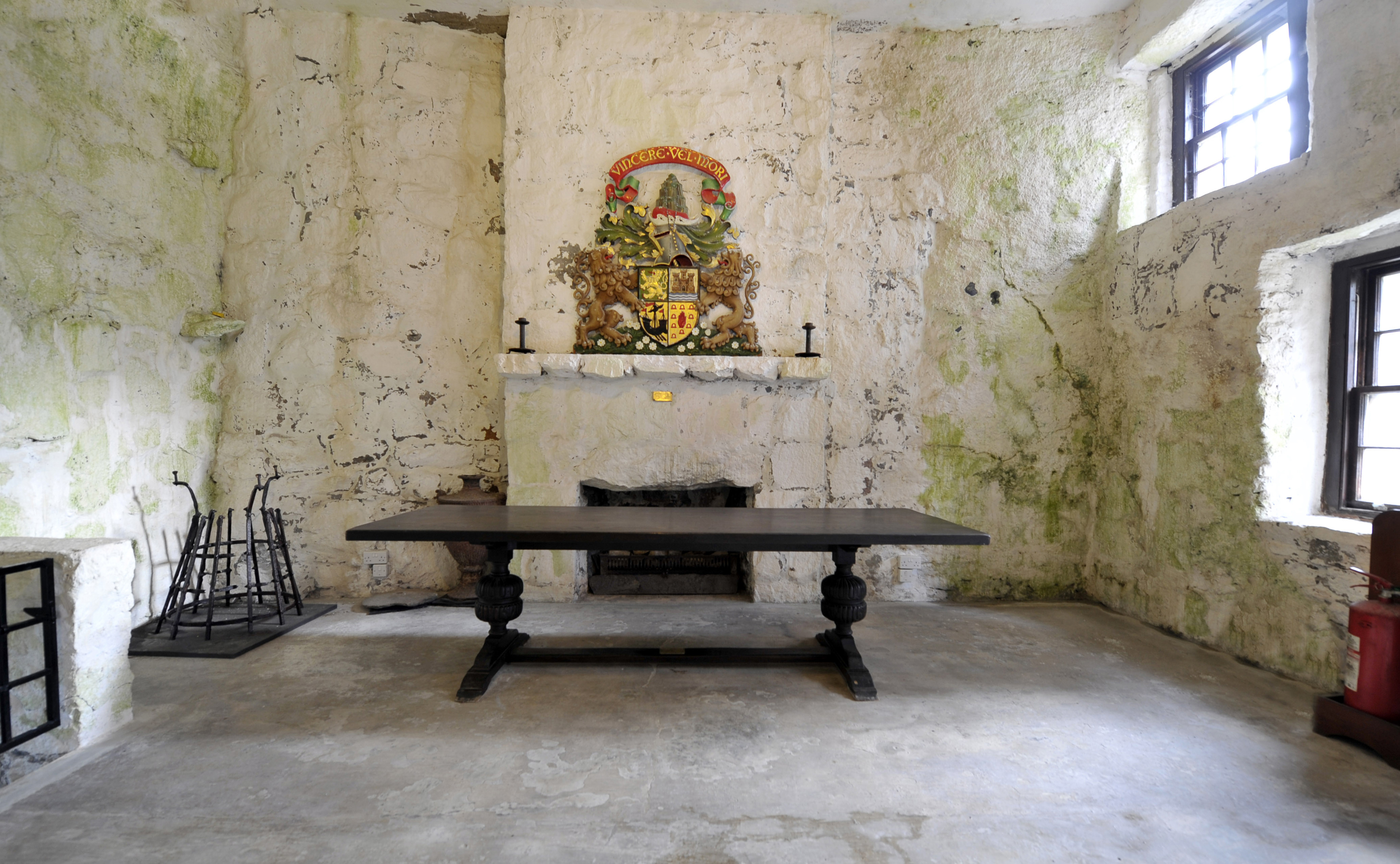 A coat of arms above the fireplace in the great hall at Kisimul Castle.